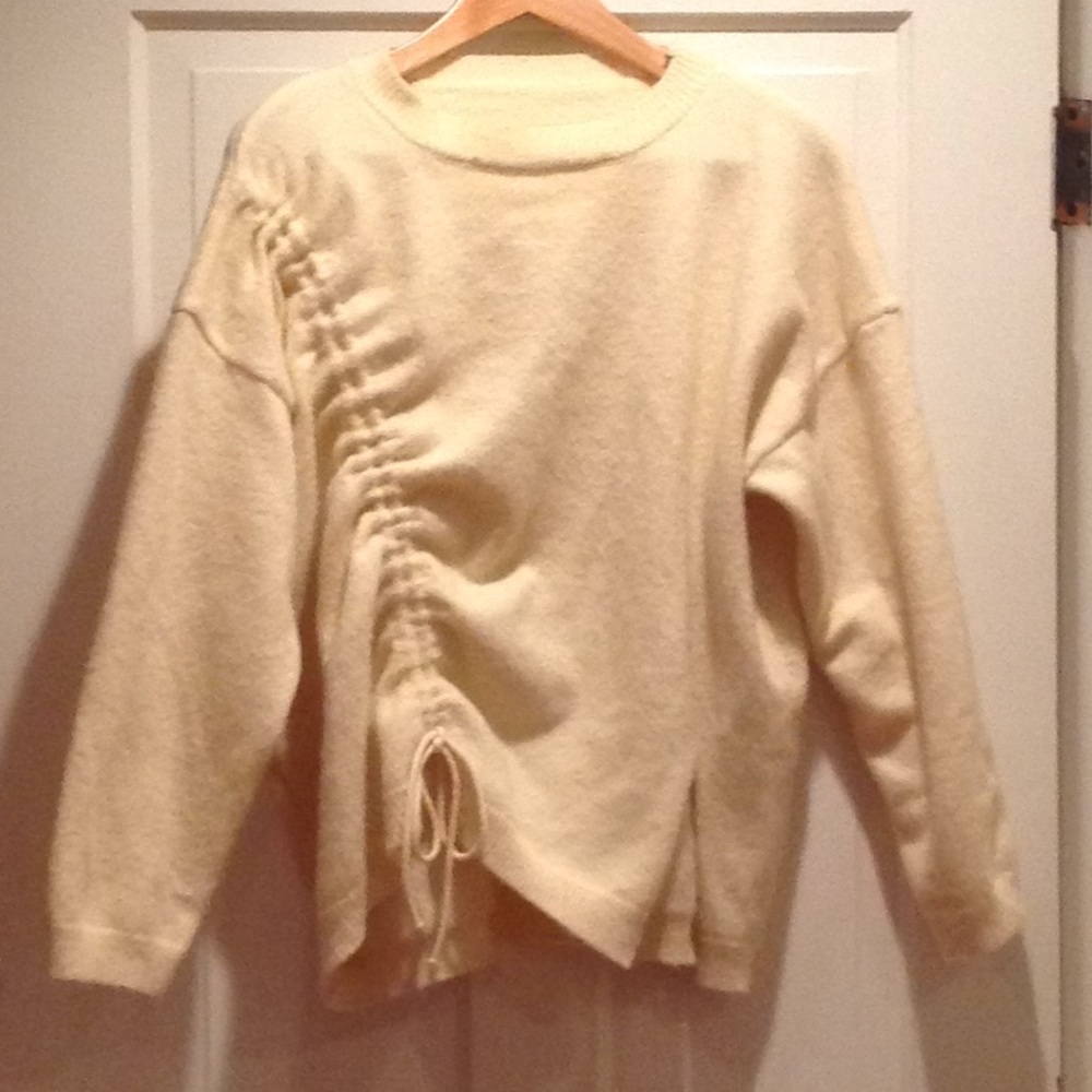 Cream sweater with tie detail